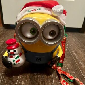 SOLD
Minions Universal Studios popcorn bucket & universal studio poncho